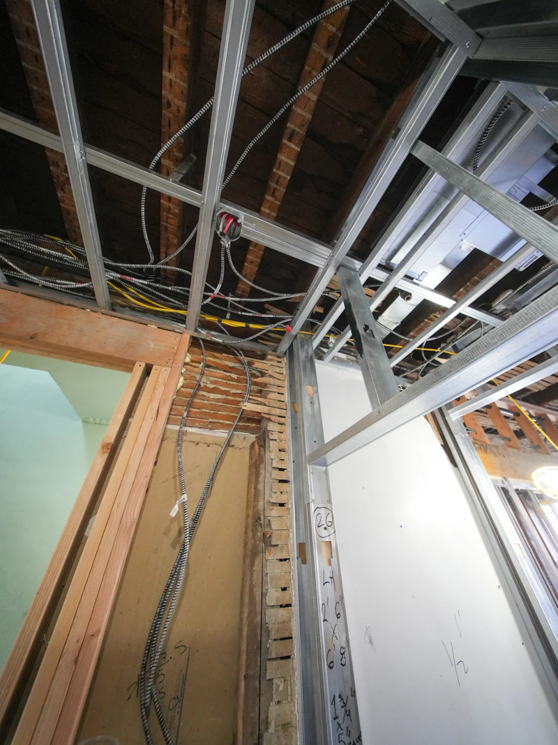 Exposed ceiling framework with services routed through it