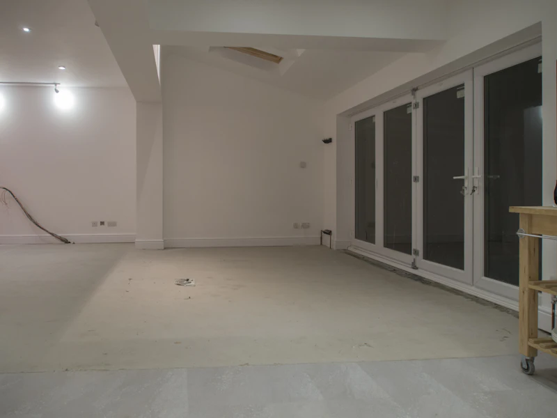 Completed room with clean white walls and glass doors